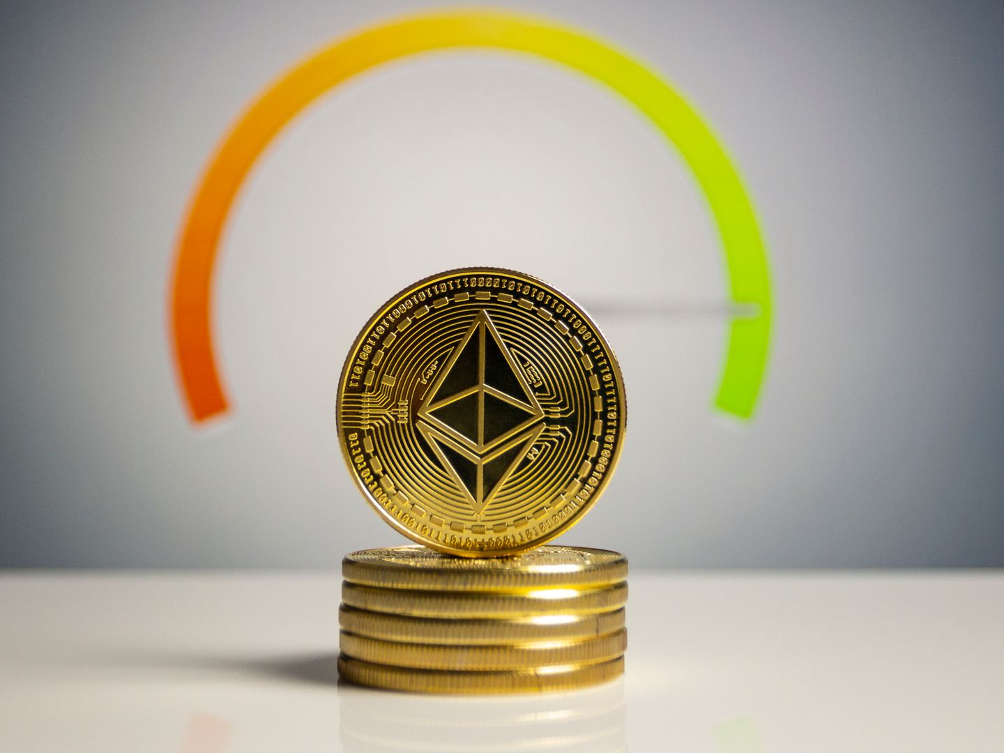 Stack of Ethereum coins with a color gradient background signifying cryptocurrency dynamics.