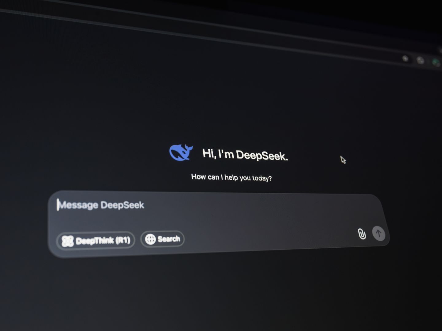Close up of a digital assistant interface on a dark screen, showcasing AI technology communication.